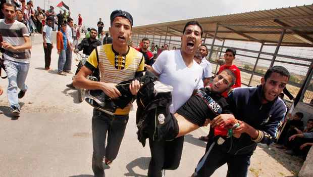 15 wounded in Gaza as Palestinians mark uprooting