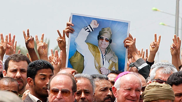 CIA chief says Qaddafi alive after hit on house
