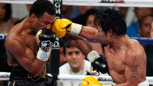 Pacquiao mauls Mosley to retain WBO title