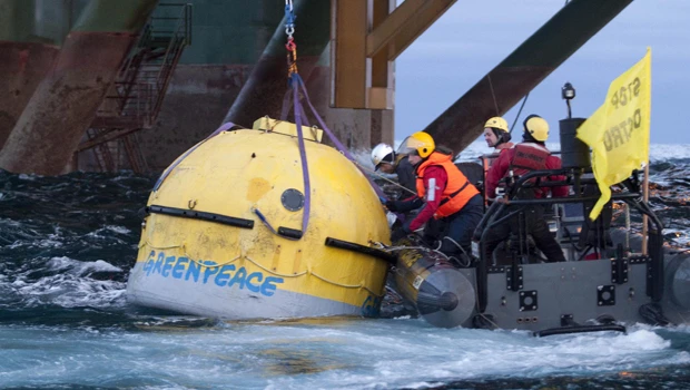 Greenpeace activists climb Greenland oil rig to stop drilling