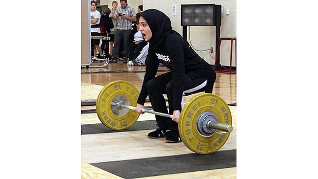 Muslim weightlifter tries to compete and remain faithful