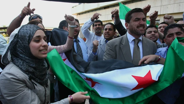 Syrian forces shell central town; death toll now 72