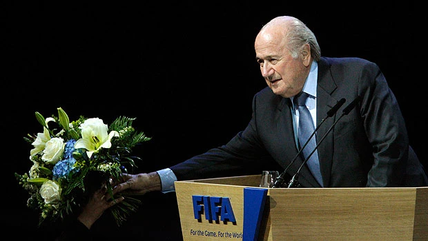 Blatter re-elected, pledges reform