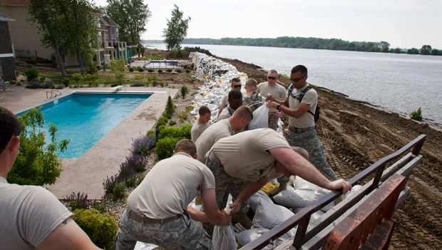 Fire, floods force evacuations in two US states