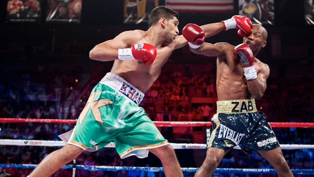 Khan KOs Judah in unification bout