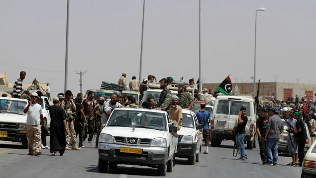 Qaddafi forces lose two towns