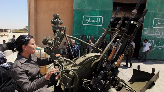 Libya’s wealthy use cash to take fight to Qaddafi