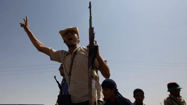 Libyan fighters loot seized towns