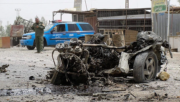 Dozens killed as bombs hit govt building in Iraq