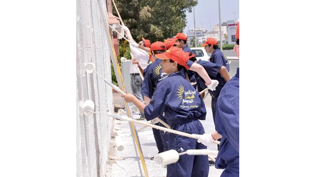 House Heroes celebrate anniversary cleaning up city walls