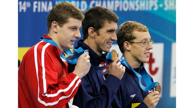 Phelps takes 3rd gold at swim worlds in 100 fly