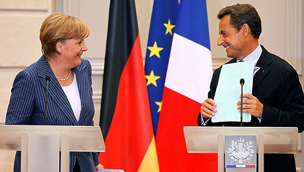 Merkel, Sarkozy vow to defend euro
