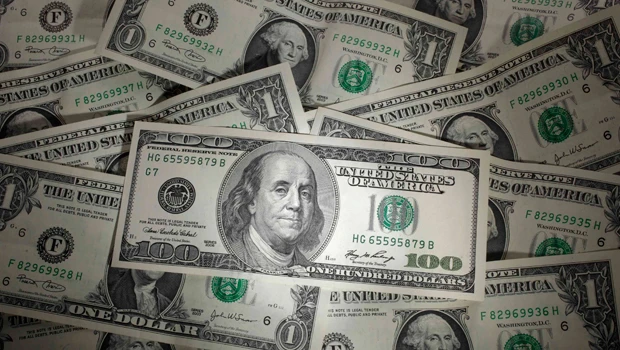 Dollar hits new low against yen, franc