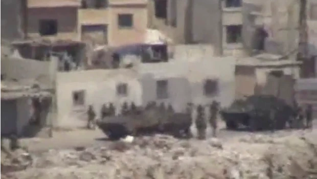 Syria forces hold hundreds in Latakia sports stadium
