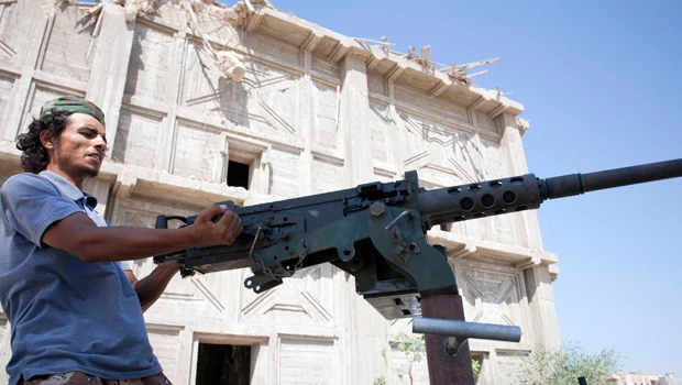 Libyan fighters seize oil refinery, eye Tripoli
