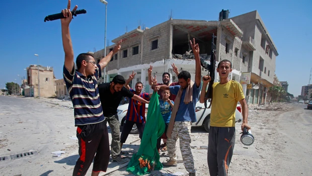 Explosions and gunfire rock besieged Tripoli