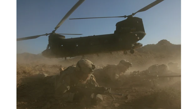 NATO, Afghan forces fight insurgents near crash