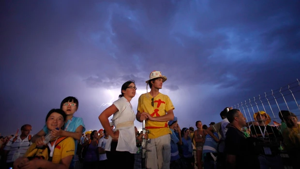 Freak storm forces pope to cut youth vigil speech
