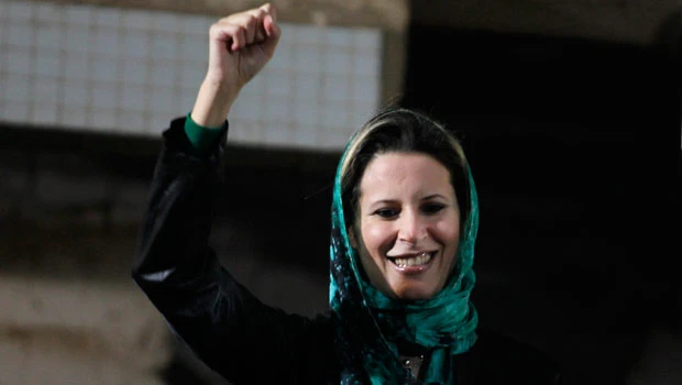Qaddafi’s daughter says father is well, fighting