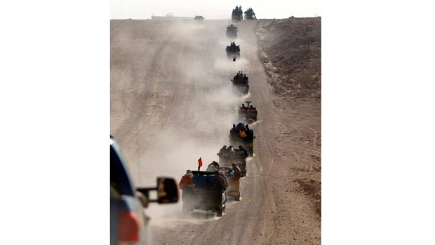 Libyan forces enter Qaddafi stronghold Sirte