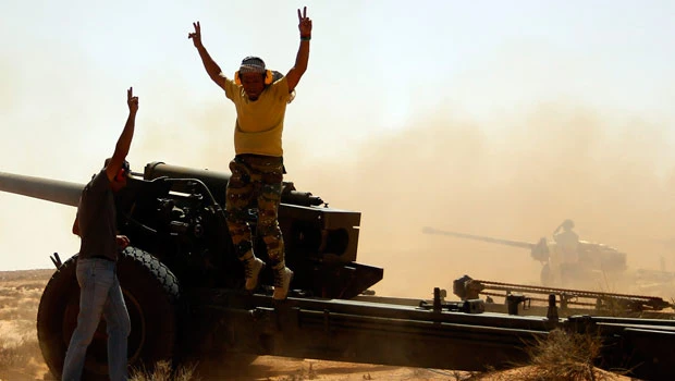 Libyan forces besiege Qaddafi’s hometown Sirte