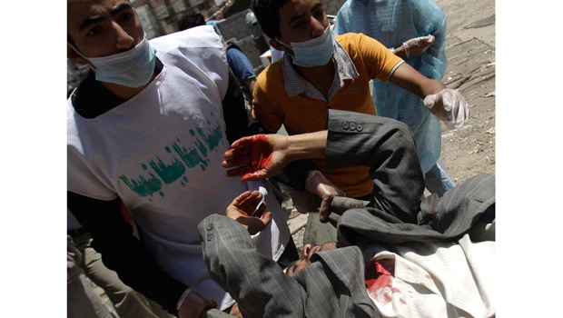 Snipers, shelling raise death toll in Yemen capital