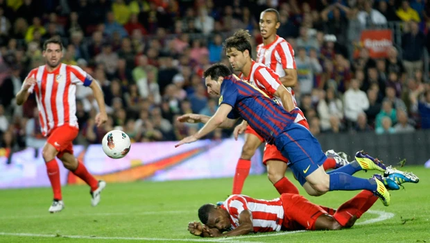 Messi, Ronaldo grab trebles in wins for Barca, Real