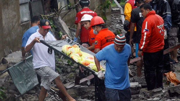 Pounding typhoon rains flood Philippine capital