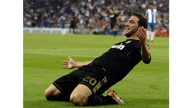 Real's Higuain scores hat trick, Barca go top
