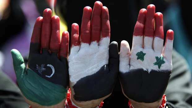 Qaddafi’s death energizes Syrian, Yemeni protests