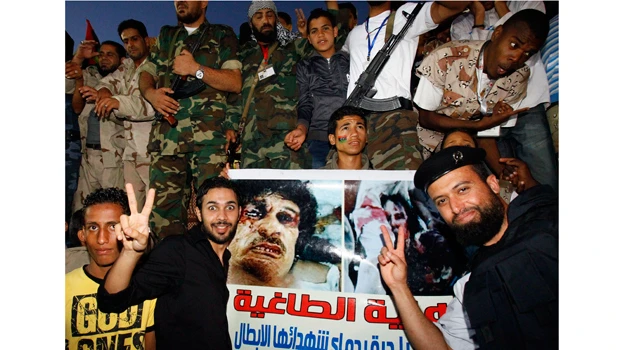 Libya ends public showing of Qaddafi’s body