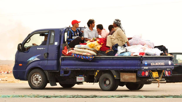 Libyans run gauntlet of bullets to escape Sirte