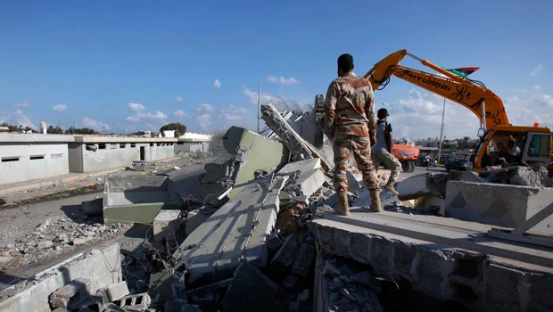 Libyans bulldoze Qaddafi’s Tripoli compound