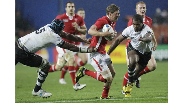 Wales thrashes Fiji to march into last eight