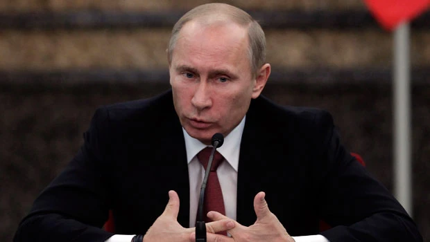 Putin slams US, makes deals in China