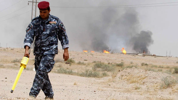 Landmines hamper Iraq oil boom, delay investment