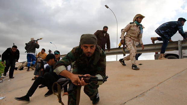 Rival Libyan militias clash near military base