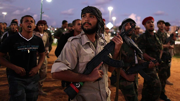 Rival Libyan rebel groups jostle over defense posts
