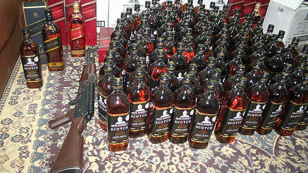Police raid on liquor den in Hail nets 118 bottles, cash and gun