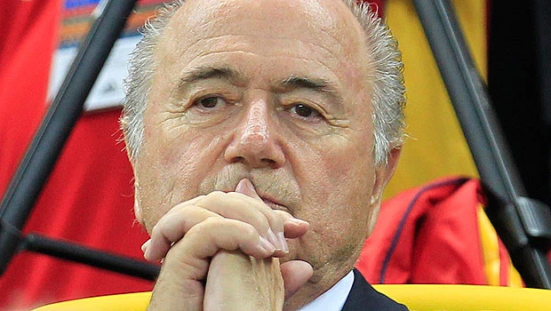 Blatter says sorry for racism remark, but won’t resign