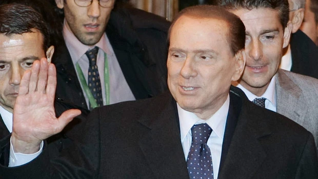 Berlusconi to resign, end scandal-hit era