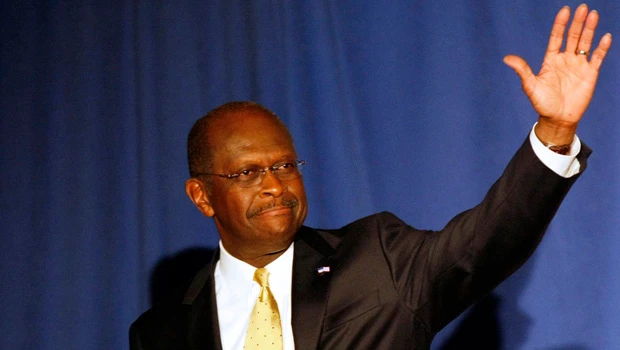 Cain tells aides he is reassessing his campaign