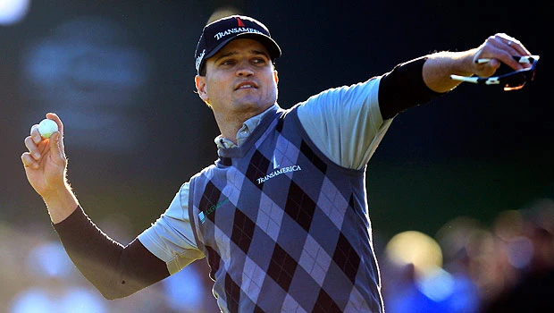 Johnson grabs 1-shot lead over Woods