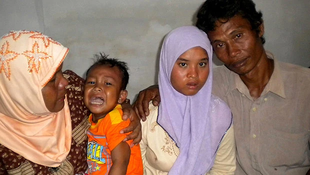 Indonesia girl back with family after 2004 tsunami