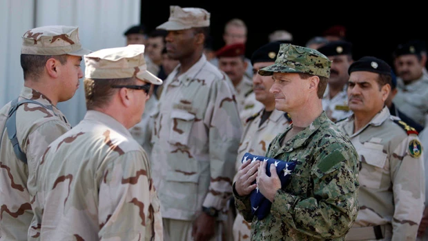 Bomb, gunmen kill 18 as Iraq marks US withdrawal