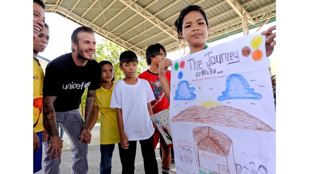 Beckham visits abused kids in Manila