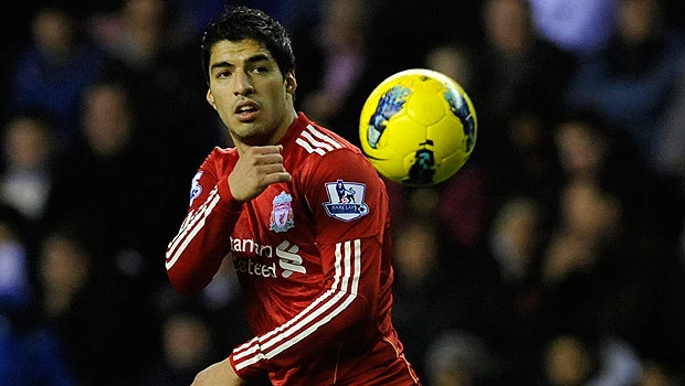 Liverpool's Suarez back in trouble with fine and ban