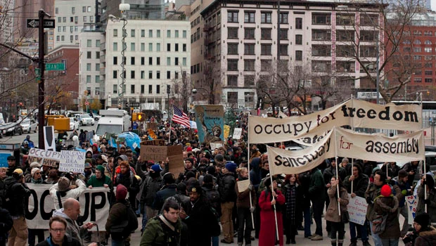 NYC protesters scale fence at vacant lot