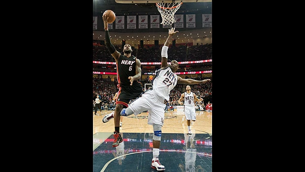James dominates in return, Heat beats Nets 101-90