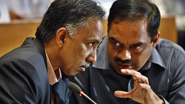 Infosys quarter profit $458m, cuts guidance